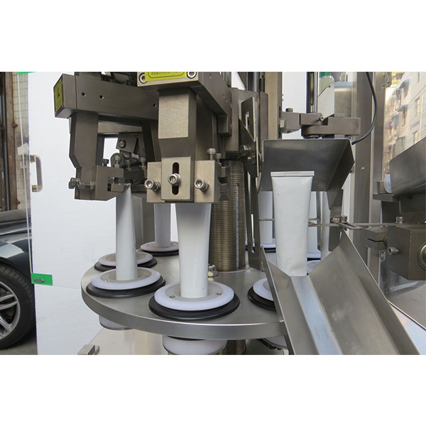 Cosmetic tube filling machine